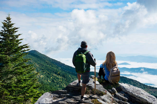 istock Friends relaxing on hiking trip in the  mountains. 1457497596