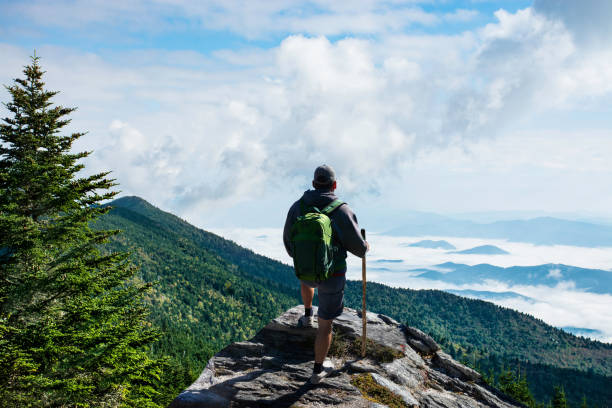istock Man relaxing on hiking trip in the mountains. 1457497598