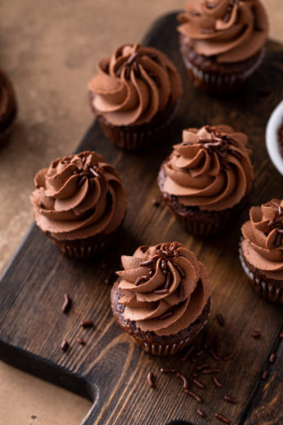 istock Dark chocolate cupcakes with chocolate ganache frosting 1457502427
