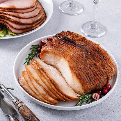 Christmas dinner meat main dishes, honey glazed spiral sliced ham and roasted turkey breast for the holidays