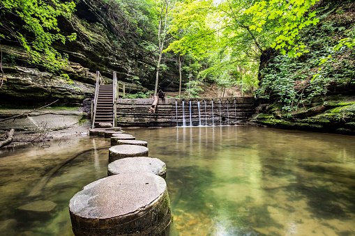 Concrete stepping stones weaving through a canyon in Matthiessen State Park in Illinois.