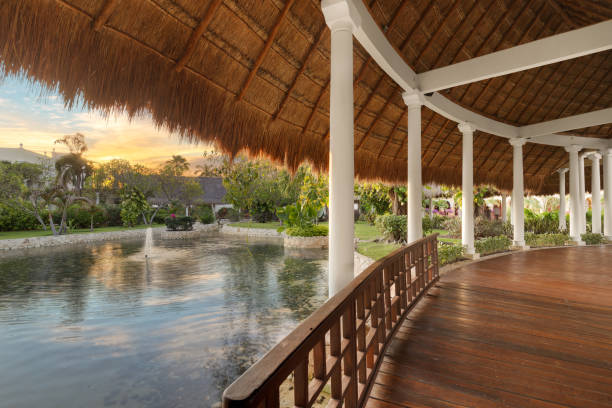 istock A Mexican sunset under a straw covered roof. 1457507045