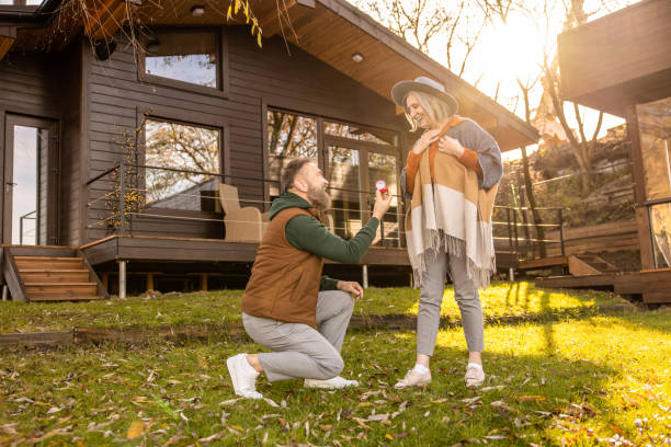 istock Man making a proposal to his beloved and giving an engagement ring 1457507710