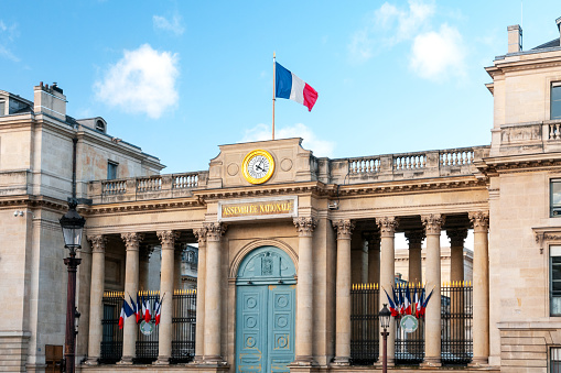 French National Assembly (Palais Bourbon), with french flag flying. Paris in France. January 15th, 2022