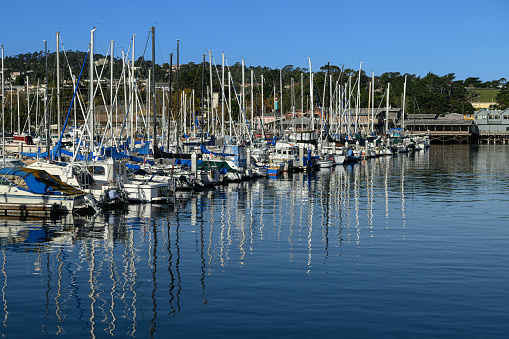 Early morning view of the Monterey Harbor and Marina, where boats are docked year round, due to ideal weather conditions.\n\nTaken in Monterey, California, USA