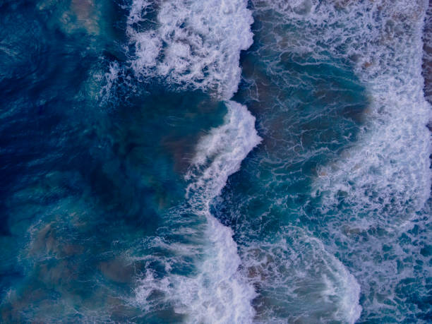 istock Big wave blue seawater top down aerial view 1457517149