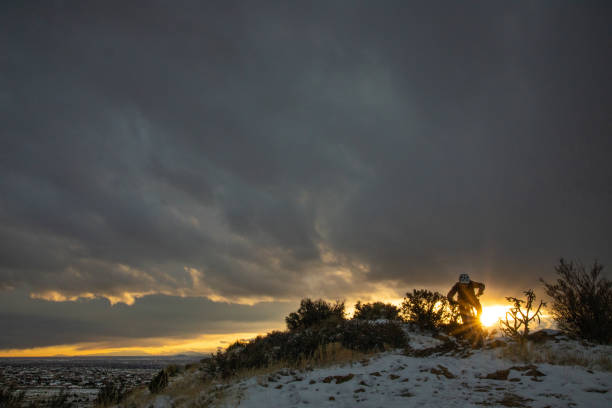 mountain biking landscape sunset stock photo