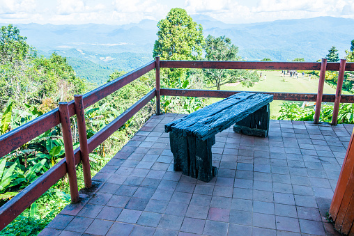 Wooden bench for view watching on mountain, Thailand.