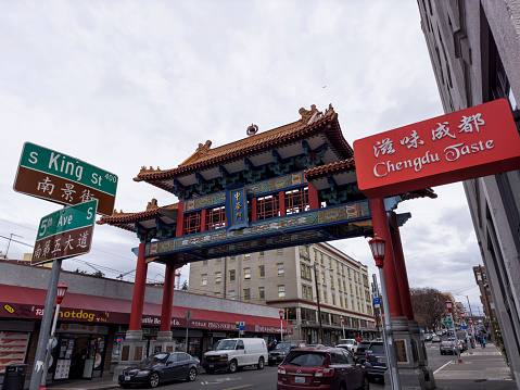 Street view of Chinatown Seattle, WA, USA on a winter afternoon. Close up of Chinatown Gate.
