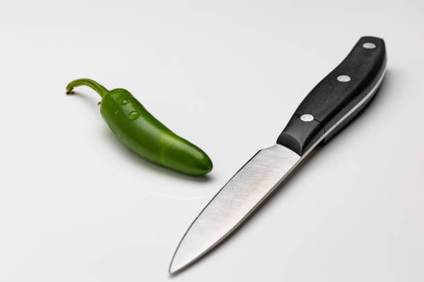 Jalapeno pepper is a medium-sized chili pepper that is typically 2-3 inches long and is a staple in Mexican cuisine. It is often pickled, canned or used fresh in dishes such as salsa, guacamole, and nachos. It has a bright green color and a moderate heat level, and is known for its slightly sweet, smoky, and slightly spicy flavor.