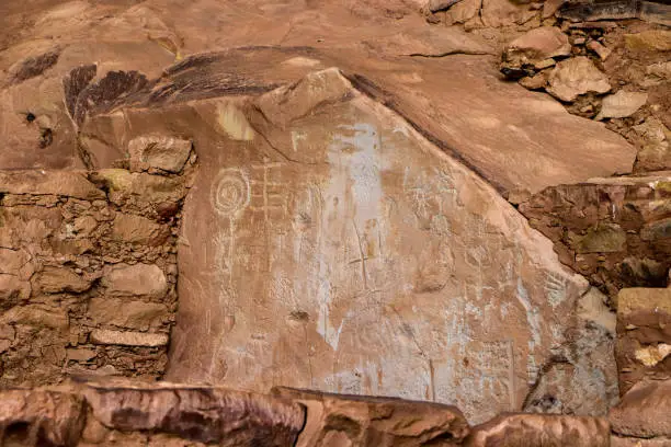 Ancient Petroglyphs on the wall of the Step House at Mesa Verde National Park near Cortez, Colorado. Petroglyphs are a communication form used by early Puebloan and anasazi people of the Four Corners region in southwestern Colorado.