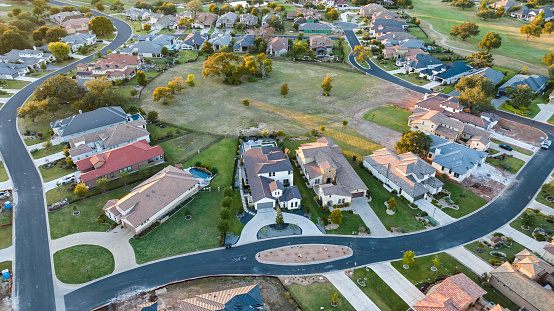 Aerial drone views at sunrise of a brand new suburb neighborhood in Georgetown Texas new suburbs new houses and homes. Endless new homes as Texas housing market expands across central texas