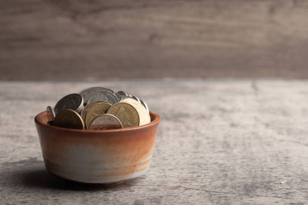 istock Coins in wooden cup.Future saving money concept.Copy space. 1457538122