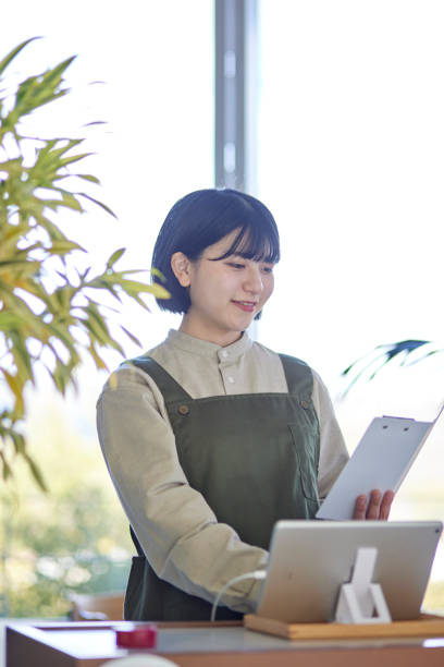 istock Young Japanese women working at cafe 1457538250