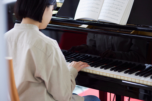 Young Japanese women playing the piano