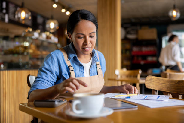 istock Business owner doing the accountancy at a cafe 1457547010