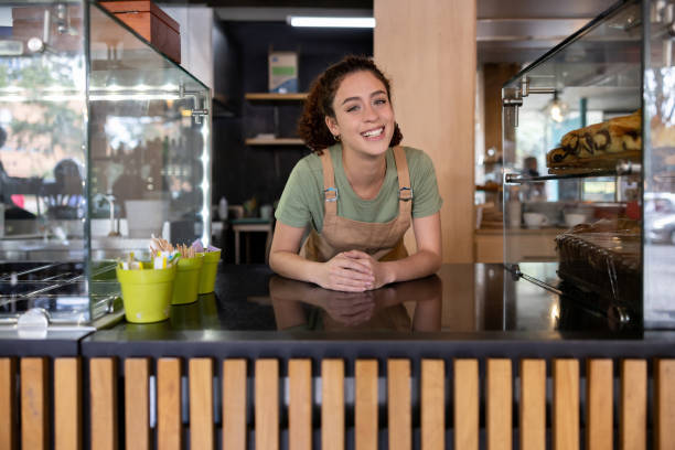 istock Happy barista working at a cafe 1457547034
