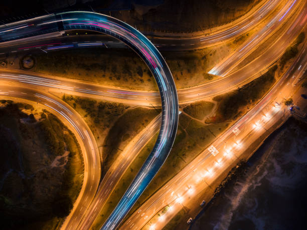 istock Top down long exposure shot of a junction at night 1457547343