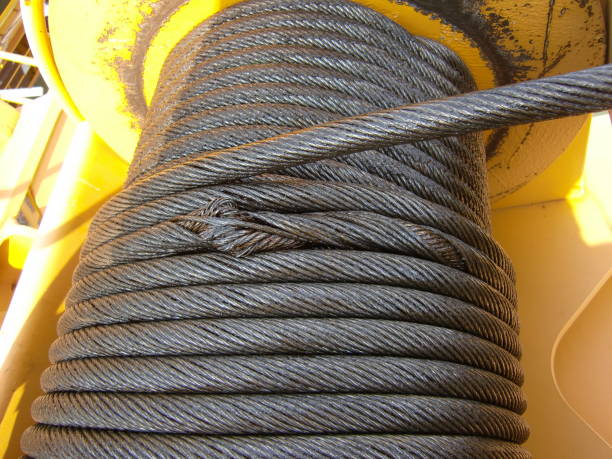 Wire rope on the crane drum Wire rope on the crane drum wire rope stock pictures, royalty-free photos & images