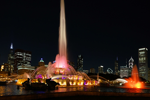 Chicago - August 30, 2022:  Chicago downtown skyline with fountain in Grant Park illuminated at night