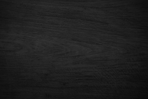 Dark wood texture background. Vintage old black boards hardwood. Charcoal timber quality high. Pattern wood grain material polished. Wooden floor detailed photo.