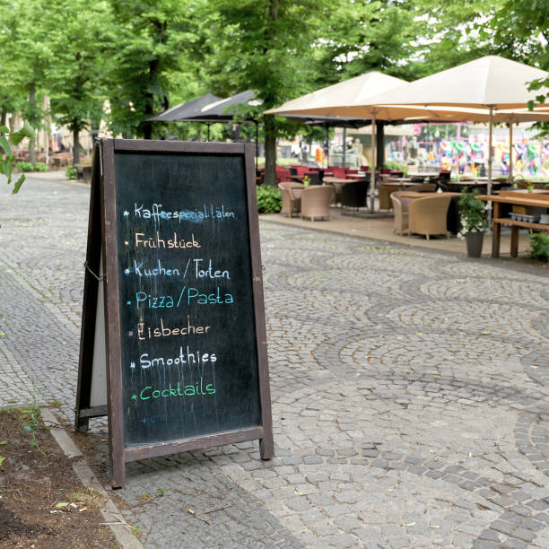istock Chalkboard with the current offers in front of a cafe in Berlin 1457558288