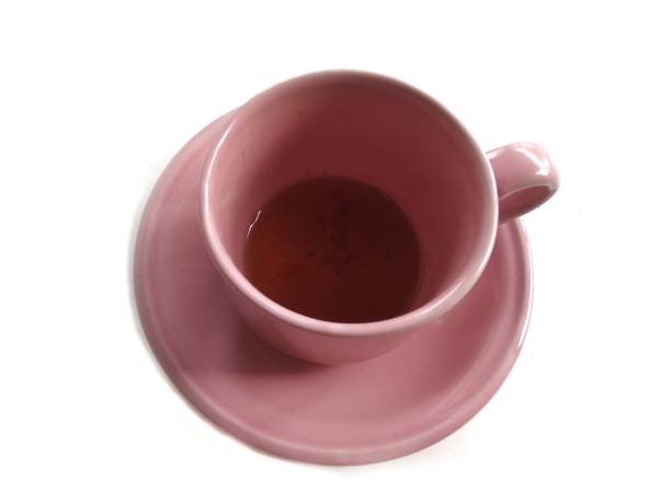 istock Pink ceramic cup isolated on white background stock photo 1457558453