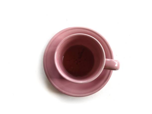 Pink ceramic cup isolated on white background stock photo