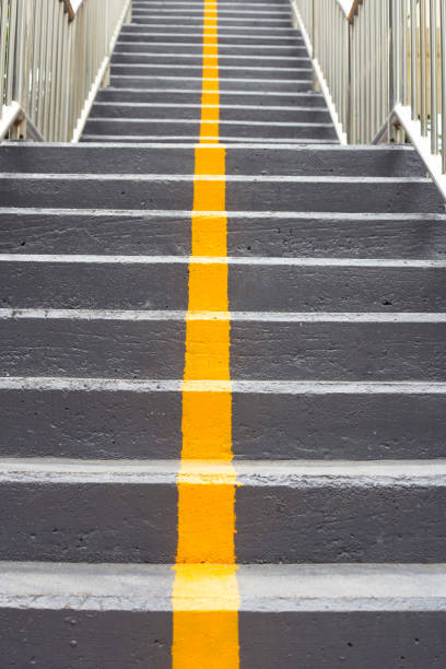istock Yellow line on stairs of the overpass 1457560643