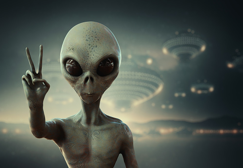 Alien pointing a finger with light at the finger tip