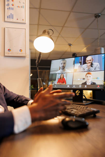 istock Entrepreneur discussing financial statistics with remote team 1457569492