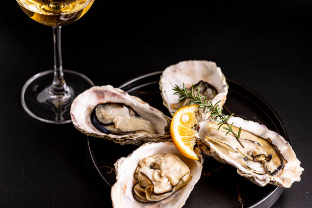 istock Very fresh raw oysters and white wine 1457572099