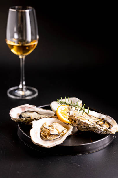 istock Very fresh raw oysters and white wine 1457572265