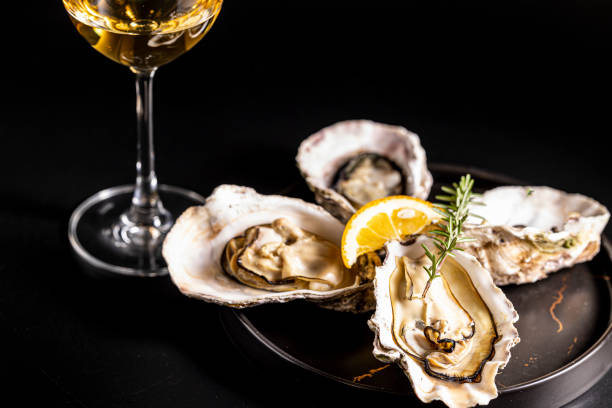 istock Very fresh raw oysters and white wine 1457572343