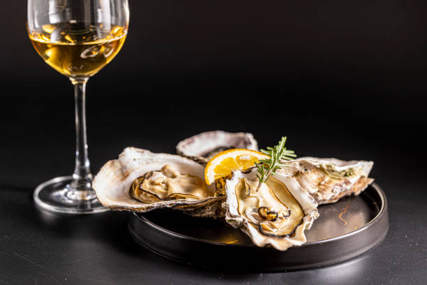 istock Very fresh raw oysters and white wine 1457572348
