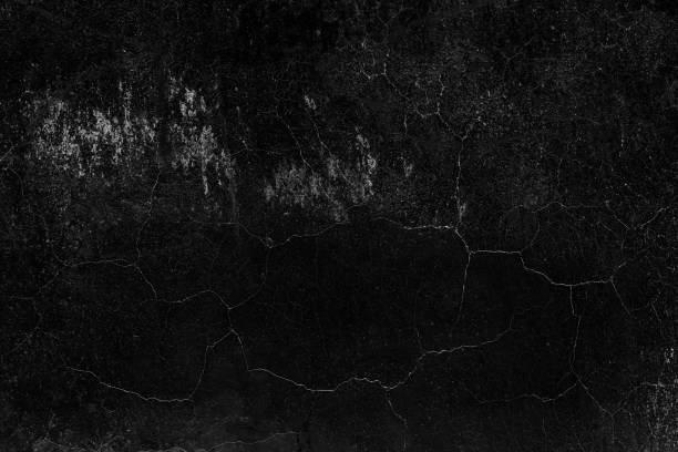 istock Dark concrete plaster wall with abstract crack and grunge texture 1457572378