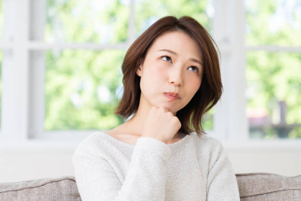 istock attractive asian woman , think 1457574476