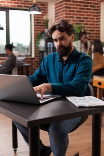 istock Busy businessman analyzing company statistics typing marketing strategy 1457582365