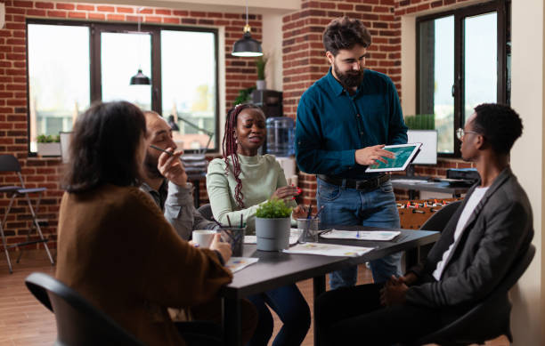 istock Entrepreneur man presenting company statistics during business meeting 1457583173