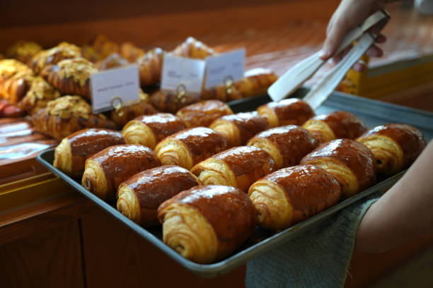 istock Cropped image of bakery owner at the bread display 1457586432
