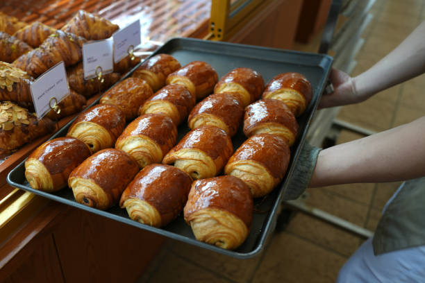 istock Cropped image of bakery owner at the bread display 1457587057
