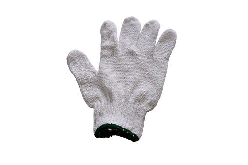 Directly above view of gardening gloves on green background.