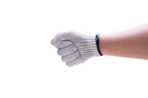 Hands wear white gloved making a fist gesture isolated on white background. Unbleached Cloth Gloves (Green Rim), Fabric Gloves for Cloth gloves to prevent danger to the hands caused by mechanic work.