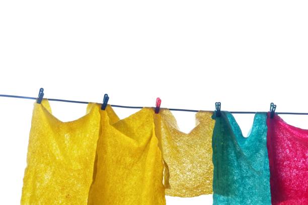 istock In Selective focus A group of multiple color rags hanging on a wire line and drying in outdoor,on white isolated background 1457591730