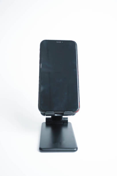 istock Black Mobile phone holder isolated on white background 1457593506