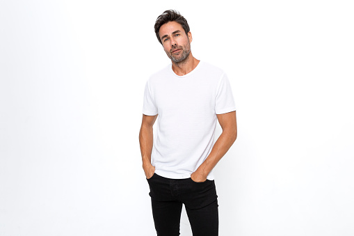 Close up of mid adult man's body in empty white t-shirt isolated on white background. Mock up for design concept. Advertising concepts. Front view.