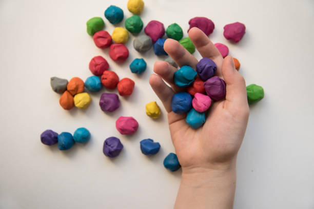istock Colorful pieces of plasticine prepared for modeling in hands 1457602512