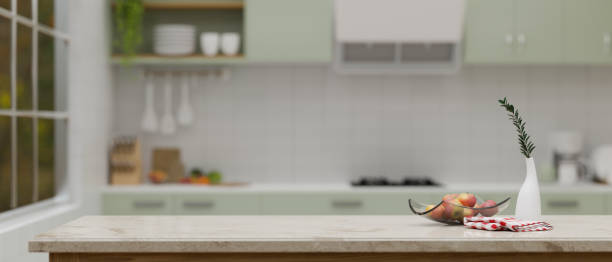 istock Montage space on luxury white kitchen tabletop over blurred background of minimal kitchen room. 1457616924