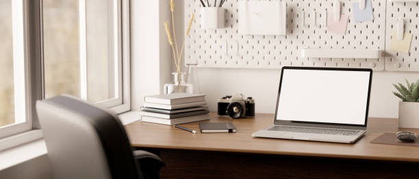istock Modern minimal home office workspace with laptop mockup and decor on wood table 1457616981