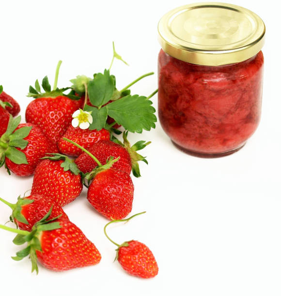 strawberry jam and fresh strawberries.
